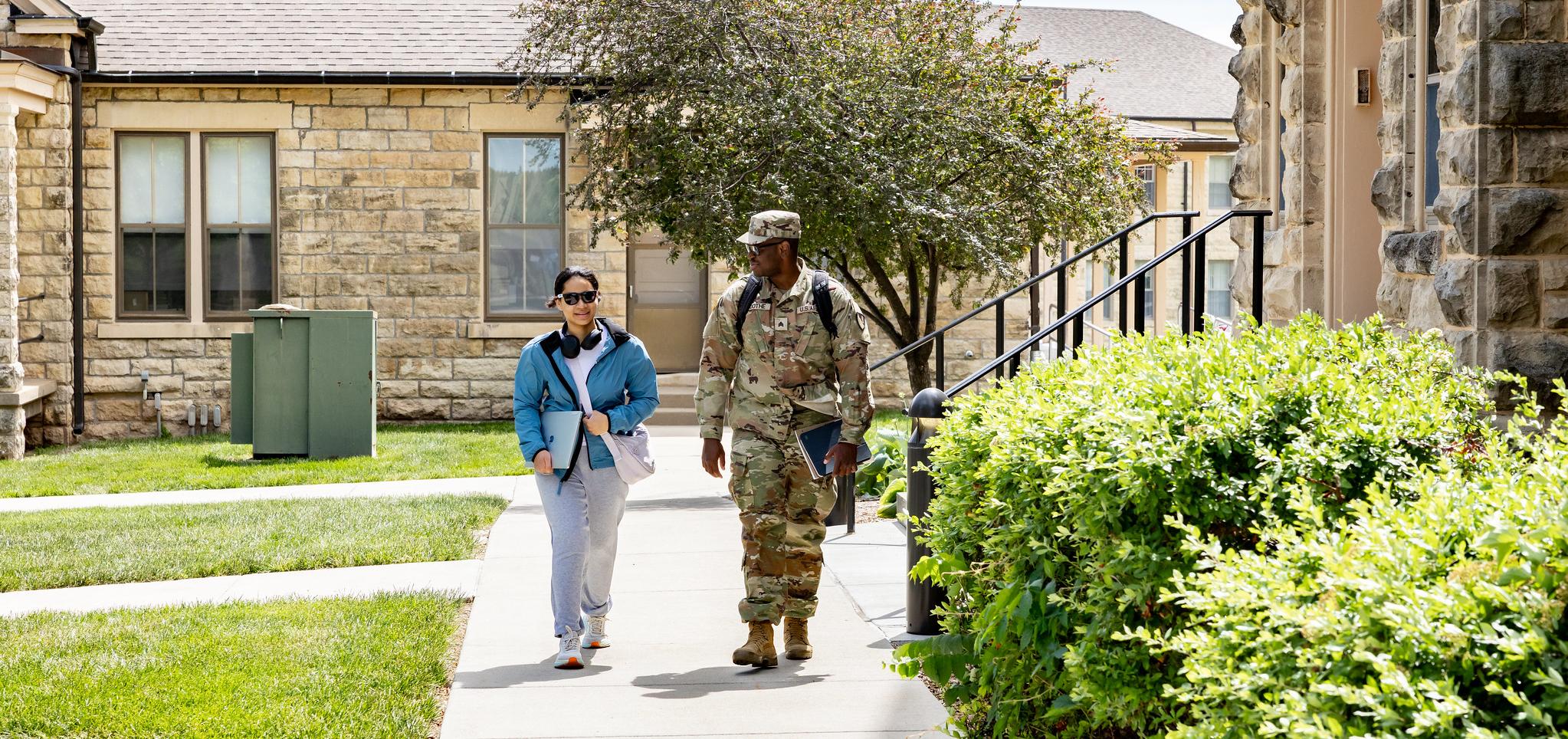 Two students walk on Fort Riley Campus